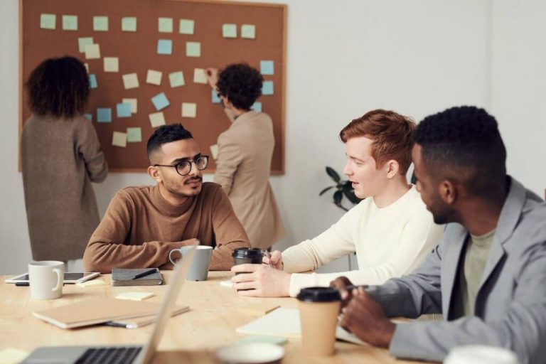 People sitting around a table and discussing